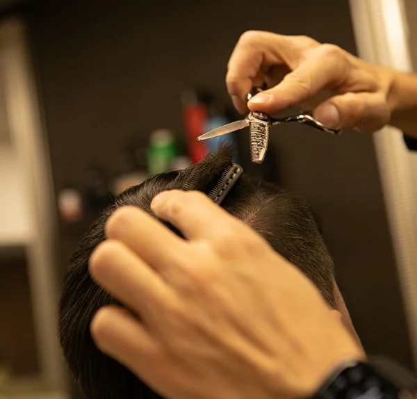 Scissor-cutting the hair on top