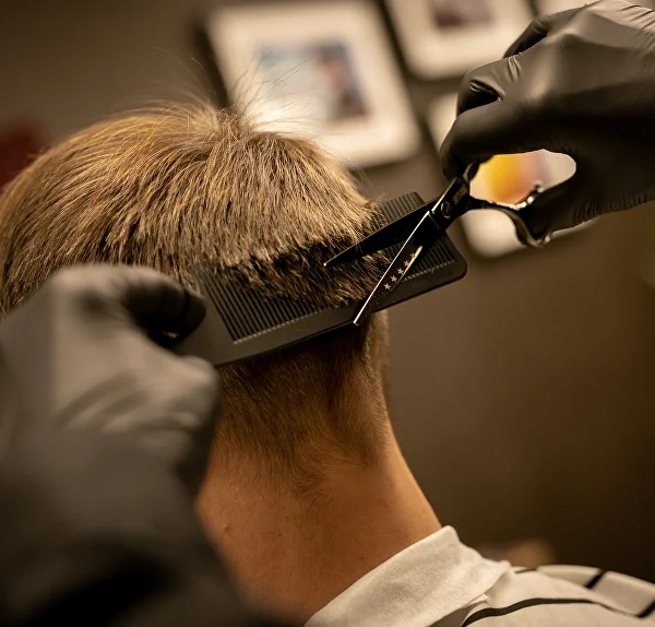 Refining a haircut at the nape with scissors